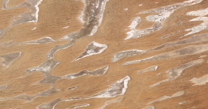 High-altitude overflight aerial of rock formations in the Simpson Desert, Australia. Clip loops and is reversible. Elements of this image furnished by USGS/NASA Landsat