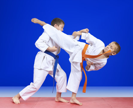 The blows karate are training two athletes