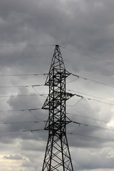 reliance power lines against a stormy sky
