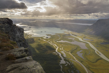 Cliff overlooking big river delta in lake autumn landscape with