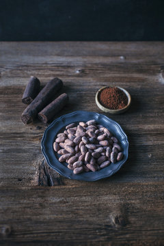 Raw cacao beans, sticks and powder