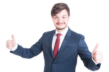 Smiling man in suit showing thumbs up