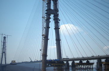 Construction of the cable-stayed bridge. Cable-stayed pylon in foreground