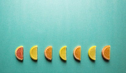 colored fruit candy in the form of orange slices, seven pieces