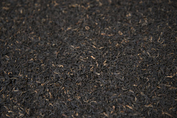 Indian black tea scattered on the table.