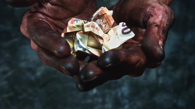 4k Technical Composition of Dirty Mechanic Hands Holding Money (euro)