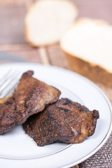 Fried pork liver served on the plate