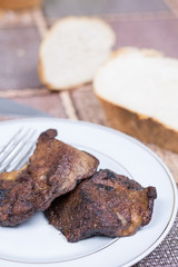 Fried pork liver served on the plate