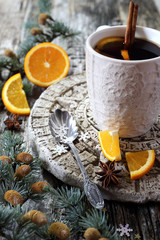 Obraz na płótnie Canvas Winter hot beverage with cinnamon and orange