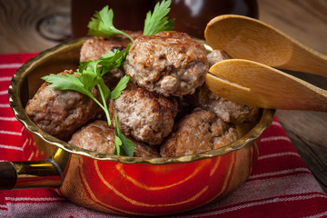 Fried pork chops in the pan.