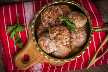 Fried pork chops in the pan.