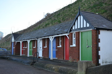 Fototapeta na wymiar beach huts coloured doors 