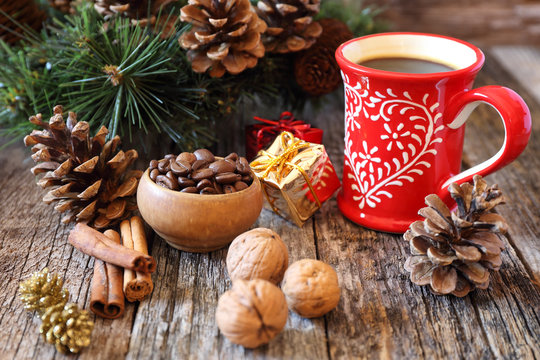 Cup of coffee, coffee beans and New-Year  decorations