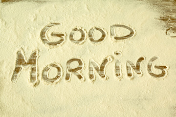 Good Morning. Word writted on the flour