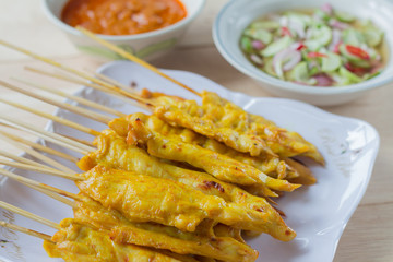 Grilled chicken satay with peanut sauce and vinegar of vegetable