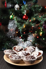 muffins on a plate/ muffins on a plate against the background of Christmas decorations