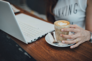 coffee latte art with woman hand