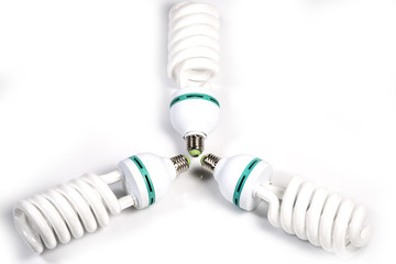 Three angled modern big white  powerful fluorescent lamps.  Macro shot on white background.