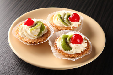 cake with cream/ cake with cream, garnished with a slice of kiwi and cherry