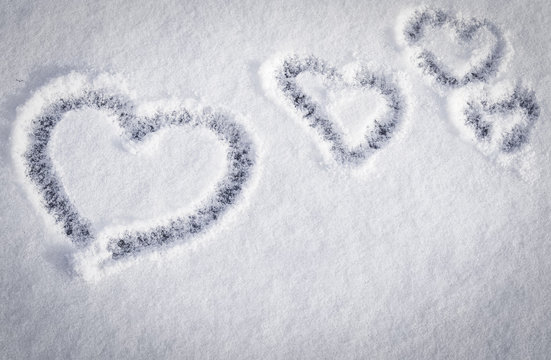 hearts on snow background with space for text