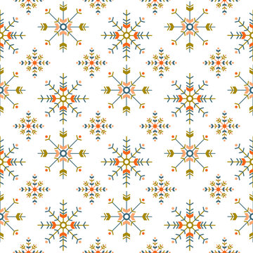 holiday ethnic seamless pattern with geometric snowflakes isolated on white background.