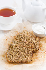 banana bread and fresh tea for breakfast, vertical