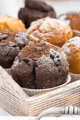 delicious muffins on a wooden tray, selective focus, vertical
