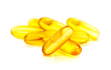 Fish oil supplement capsule isolated on white background