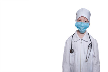 Child in a medical gown, cap, mask, stethoscope on a white backg