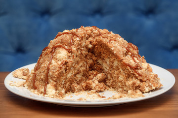 Sweet cake with cream on plate closeup
