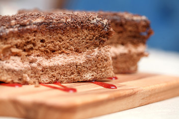 Slices of chocolate cake with cream closeup