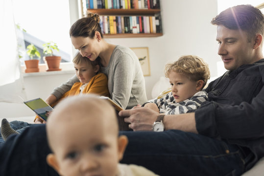 Family relaxing on sofa