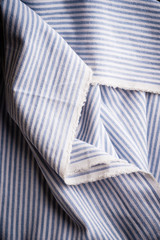 the checkered tablecloth on black stone background. Use for background.