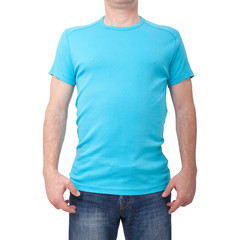 Obraz premium Man wearing blank blue t-shirt isolated on white background with copy space. Tshirt design and people concept - close up of men in blank shirt. For mock up template design. Front view
