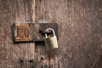 Old master key rusty  lock wooden door.