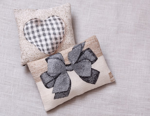 Cushion with heart and bow
