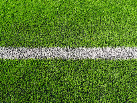 close up shot of soccer field, sideline, made from synthetic law