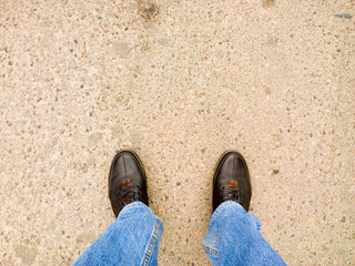 Fototapeta na wymiar Feet on the cobblestone.