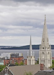 Fototapeta na wymiar view towards the church steeple of Saint Mary's Cathedral Basilica on Halifax, Bedford in the far background; Nova Scotia Canada 