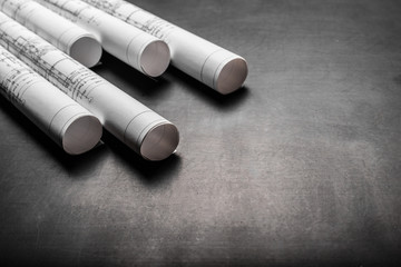 Construction planning drawings on black background