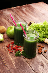 Healthy green smoothie and ingredients - superfoods, detox, diet, health, vegetarian food concept