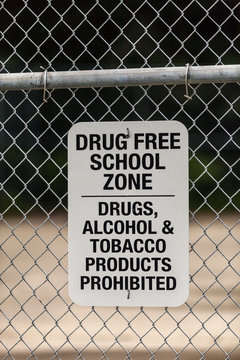 Warning sign on school wire fence, Seldovia, Kachemak Bay, Alaska, USA