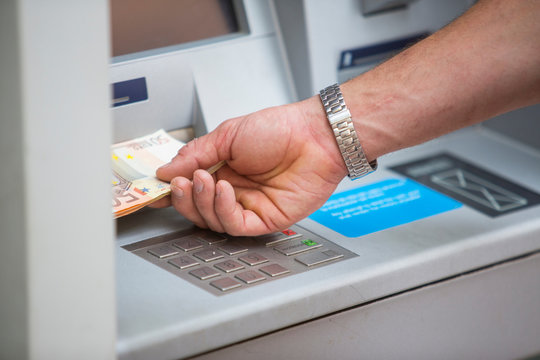 Man withdrawing cash from cash machine