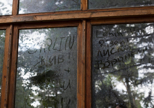 Graffiti written in dirt on window, Sochi, Russia