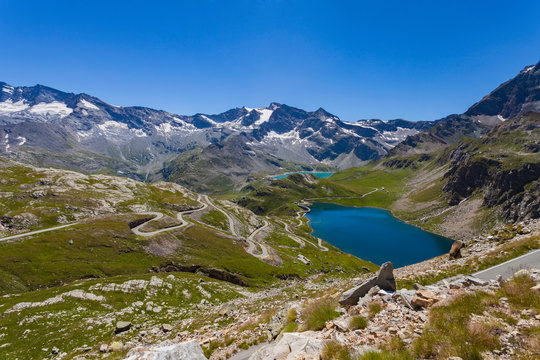 Scenic view of alps and lake, Colle del Nivolet, Piedmont, Italy