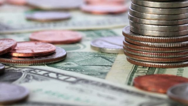 A Pile Of Coins And Cash. Shot Slider.