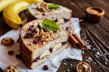 Banana toasts with walnut, cranberries and cinnamon