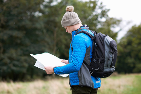 Hiker looking at paper map