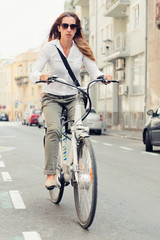Fototapeta na wymiar Woman riding electric bicycle