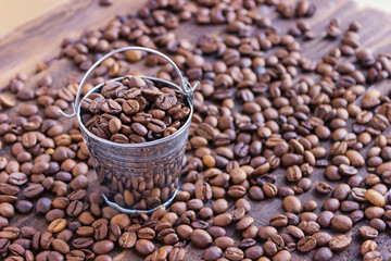 Background natural black coffee.Grain black coffee in bulk. Roasted beans Black coffee. Grain black coffee in bulk.
